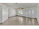 Spacious living room featuring tile flooring and decorative leaded glass front door and sidelights at 700 Roby Ct, Dundee, FL 33838