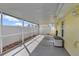 View of the covered patio with a white privacy fence and concrete flooring, perfect for outdoor relaxation at 700 Roby Ct, Dundee, FL 33838