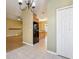 View of the open layout showcases the dining room, kitchen, and living room at 7624 Bay Port Rd # 40, Orlando, FL 32819