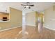 Bright, open living room with wood floors and seamless flow to other living areas at 7624 Bay Port Rd # 40, Orlando, FL 32819