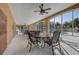 Enclosed patio with seating and a view of the pool area, ideal for outdoor dining and entertaining at 7624 Bay Port Rd # 40, Orlando, FL 32819