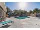 Outdoor pool area with lounge chairs, umbrellas, and lush tropical foliage, perfect for relaxation at 7624 Bay Port Rd # 40, Orlando, FL 32819