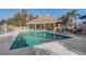 Inviting community pool surrounded by lounge chairs and umbrellas, perfect for relaxation at 7624 Bay Port Rd # 40, Orlando, FL 32819