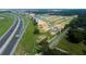 Aerial view of new community near a highway with construction underway on vacant lots at 780 Pointe Emerson Blvd, Apopka, FL 32703