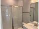This bathroom features a glass-enclosed shower, sleek fixtures, and a modern vanity at 780 Pointe Emerson Blvd, Apopka, FL 32703