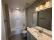 Bright bathroom featuring a tub, shower, and modern vanity with a spacious countertop at 780 Pointe Emerson Blvd, Apopka, FL 32703