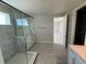 Modern bathroom featuring a glass-enclosed shower, tiled floor, and white vanity with ample storage at 780 Pointe Emerson Blvd, Apopka, FL 32703