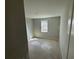Comfortable bedroom with a view from the window and an interior door at 780 Pointe Emerson Blvd, Apopka, FL 32703