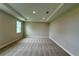 Carpeted bedroom with recessed lighting and tray ceiling detail at 780 Pointe Emerson Blvd, Apopka, FL 32703