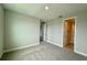 A cozy bedroom features neutral walls, plush carpeting, and bright white trim at 780 Pointe Emerson Blvd, Apopka, FL 32703