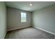 Neutral carpeted bedroom with window at 780 Pointe Emerson Blvd, Apopka, FL 32703