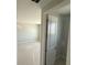 Bright bedroom with fresh paint and trim seen through an open door at 780 Pointe Emerson Blvd, Apopka, FL 32703