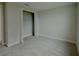 Carpeted bedroom with walk-in closet at 780 Pointe Emerson Blvd, Apopka, FL 32703