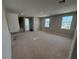 Large bedroom with ample natural light, offering a blank canvas for personalization and comfort at 780 Pointe Emerson Blvd, Apopka, FL 32703