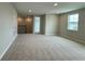 Upstairs bonus room with neutral carpet, recessed lighting, and a window for natural light at 780 Pointe Emerson Blvd, Apopka, FL 32703