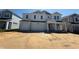 Well-designed two-story home with a spacious three-car garage, set in a community close to construction at 780 Pointe Emerson Blvd, Apopka, FL 32703