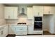 Kitchen featuring white cabinets, stainless steel appliances, and a gas range at 780 Pointe Emerson Blvd, Apopka, FL 32703