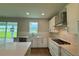Bright kitchen with stainless steel appliances, a gas cooktop, and ample counter space at 780 Pointe Emerson Blvd, Apopka, FL 32703