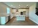 Spacious kitchen featuring white cabinets, stainless steel appliances, and a center island at 780 Pointe Emerson Blvd, Apopka, FL 32703