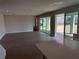 Expansive living area with tile floors and large sliding doors leading to the outdoor space at 780 Pointe Emerson Blvd, Apopka, FL 32703