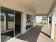A covered patio offers an outdoor living space with sliding glass door access at 780 Pointe Emerson Blvd, Apopka, FL 32703