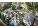 Aerial view of a refreshing pool and cabana area surrounded by lush landscaping and stylish homes at 780 Pointe Emerson Blvd, Apopka, FL 32703