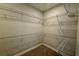 Walk-in closet with carpeted floors and metal shelving throughout at 780 Pointe Emerson Blvd, Apopka, FL 32703