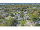 Overhead view of the home in a mature neighborhood with tree lined street and manicured lawns at 9532 Bay Vista Estates Blvd # 1, Orlando, FL 32836