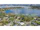 Aerial view of homes on a lake highlighting the beautiful waterfront community and serene setting at 9532 Bay Vista Estates Blvd # 1, Orlando, FL 32836