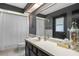 Stylish bathroom featuring a vanity with a mirror, white shower curtain, and neutral wall color at 9532 Bay Vista Estates Blvd # 1, Orlando, FL 32836
