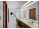 Large bathroom featuring a double vanity, a separate shower, and a jetted tub at 9532 Bay Vista Estates Blvd # 1, Orlando, FL 32836