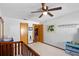 bedroom with ceiling fan, toy organizers and access to other rooms at 9532 Bay Vista Estates Blvd # 1, Orlando, FL 32836