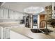 Bright kitchen with stainless steel appliances, white cabinets, and modern countertops at 9532 Bay Vista Estates Blvd # 1, Orlando, FL 32836
