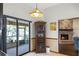 Cozy breakfast nook with views, decorative cabinet, and brick fireplace at 9532 Bay Vista Estates Blvd # 1, Orlando, FL 32836
