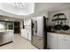 Well-lit kitchen with stainless steel appliances, white cabinetry, and spacious countertops at 9532 Bay Vista Estates Blvd # 1, Orlando, FL 32836