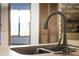 Modern kitchen sink with a sleek faucet and neutral countertops at 9532 Bay Vista Estates Blvd # 1, Orlando, FL 32836