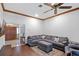 Spacious living room with ceiling fan, stylish sectional, and elegant décor at 9532 Bay Vista Estates Blvd # 1, Orlando, FL 32836