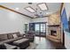 Comfortable living room with fireplace, ceiling detail, and ample seating at 9532 Bay Vista Estates Blvd # 1, Orlando, FL 32836