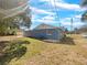 Exterior backyard view featuring a well kept lawn and a screened porch at 996 E Normandy Blvd, Deltona, FL 32725