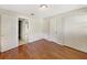 Bedroom with wood floors, closet and neutral wall paint at 996 E Normandy Blvd, Deltona, FL 32725