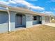 Front elevation view featuring a well kept lawn and a screened porch at 996 E Normandy Blvd, Deltona, FL 32725