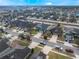 Aerial view of a neighborhood with well-maintained streets and sidewalks at 1230 Woodlark Dr, Haines City, FL 33844