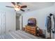 Cozy bedroom featuring a ceiling fan and neutral decor at 1230 Woodlark Dr, Haines City, FL 33844