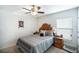 Inviting bedroom showcasing a sun-themed headboard and cozy bedding at 1230 Woodlark Dr, Haines City, FL 33844