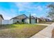 Charming home with a well-manicured front lawn and a spacious driveway at 1230 Woodlark Dr, Haines City, FL 33844