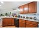Bright kitchen with granite counters, ample cabinet space, and modern black appliances at 1230 Woodlark Dr, Haines City, FL 33844