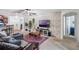 Comfortable living room with modern decor, including a brick accent wall and stylish furnishings at 1230 Woodlark Dr, Haines City, FL 33844