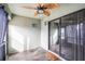 Relaxing patio with tile flooring and a ceiling fan at 1230 Woodlark Dr, Haines City, FL 33844