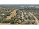 Aerial view of a neighborhood with lush greenery and well-maintained homes at 1037 Truffles Ct, Apopka, FL 32712