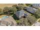 Aerial view of a spacious home with a private backyard and a dark roof at 1037 Truffles Ct, Apopka, FL 32712